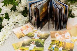 Photo book with a cover . White color with openwork stamping. Soft focus.