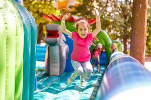 Cute little girl in amusement park photo