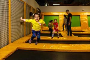 Children playing on a inflatable trampoline photo