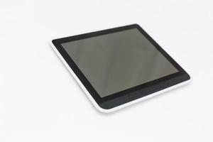 tablet computer with blank screen mockup lies on the surface, isolated on white background. Whole image in focus, high quality photo