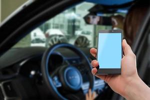 Close-up Of Woman Sitting Inside Car Typing Text Message On Mobile Phone photo