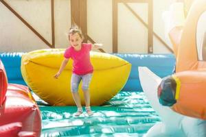 child on a colorful trampoline photo