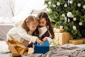 Two little girls in Christmas background photo