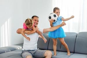 little girls with soccer ball at home photo