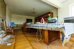 Devastated kitchen in a demolition house photo