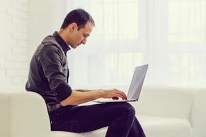 Businessman analyzing investment charts with laptop. Accounting photo