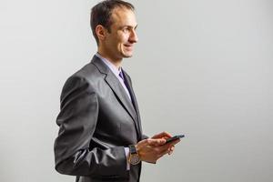 Mobile App Advertisement. Handsome Excited man with phone. photo