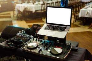 Dj mixes the track in the nightclub photo