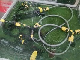 Garden irrigation system watering lawn photo