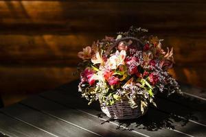 bouquet of summer flowers in a basket photo