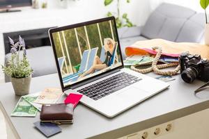 Woman summer freelance nomand relaxing with laptop near swimming pool colorful beautiful outdoors. Traveling Bali with a computer wi-fi poolside nature tropical palms, always in touch concept photo