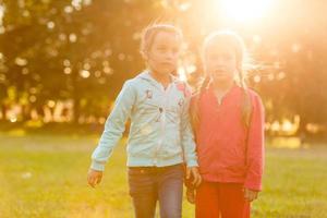 Beautiful little girls enjoying outside photo