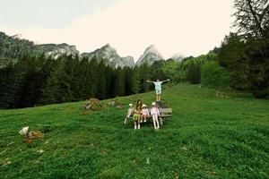 Mother with kids at Vorderer Gosausee mountains, Gosau, Upper Austria. photo