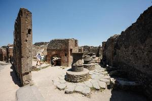 Children tourist walking at Pompeii ancient city, Italy. photo