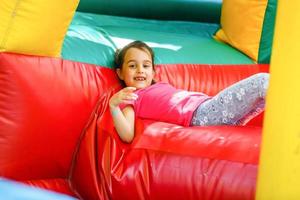 child on a colorful trampoline photo