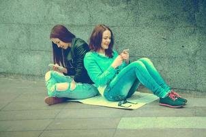 girls sitting on the street photo