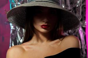 portrait of charming young caucasian woman in hat photo