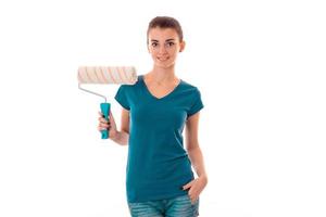 adorable young slim builder girl makes renovations isolated on white background photo