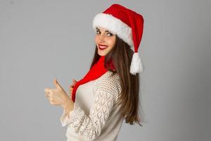 girl in santa hat and red scarf photo