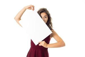 girl in red dress with white placard photo