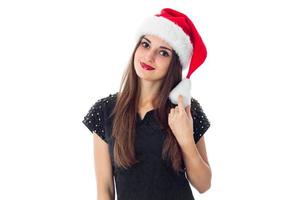 charming brunette girl in santa hat photo