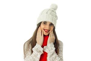 brunette girl in warm sweater and red scarf photo