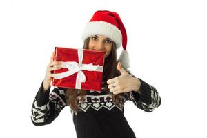 cute girl in warm sweater and santa hat photo