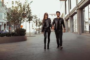 Fashionable couple walks around the street photo