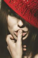 Gorgeous adult woman with red hat in retro style photo