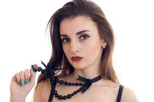 Portrait of sexual young girl with red lipstick and a necklace on the neck isolated on white background photo