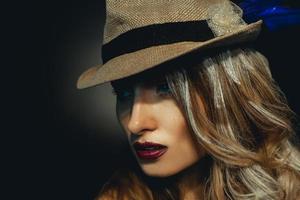 Horizontal picture of beauty young girl with nice makeup in stylish hat photo