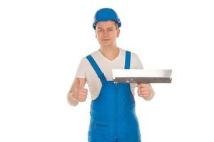 worker with putty knife in hand photo