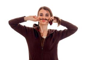 portrait of young funny student girl in brown sport clothes isolated on white background photo