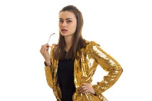 Beautiful lady in golden jacket posing on camera photo