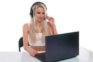 The girl in headphones with laptop photo