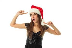 portrait of cheerful woman in santa hat photo