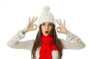 brunette girl in warm sweater and red scarf photo