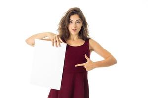 girl in red dress with white placard photo