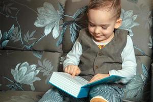little boy read a book photo