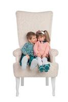 Children sit in a chair photo