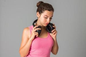 girl with headphones in studio photo