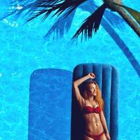 portrait of sexual young lady in red bikini photo