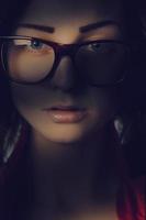 Pretty girl in glasses in shadows lines photo