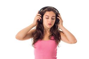 girl in headphones in studio photo