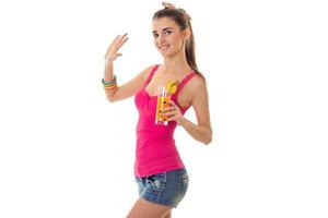 summertime portrait of young beautiful brunette woman with cocktail in her hands posing isolated on white background photo