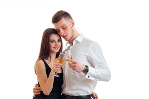 attractive girl and Guy smiling embrace each other and holding wine glasses photo