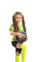 cutie little girl with soccer ball in hands photo