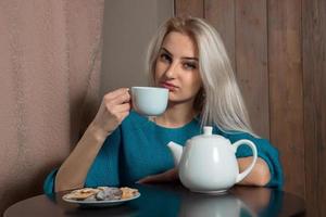 Girl drinking tea photo