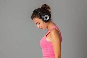 girl with headphones in studio photo