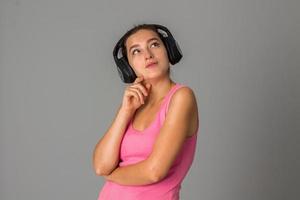 girl with headphones in studio photo